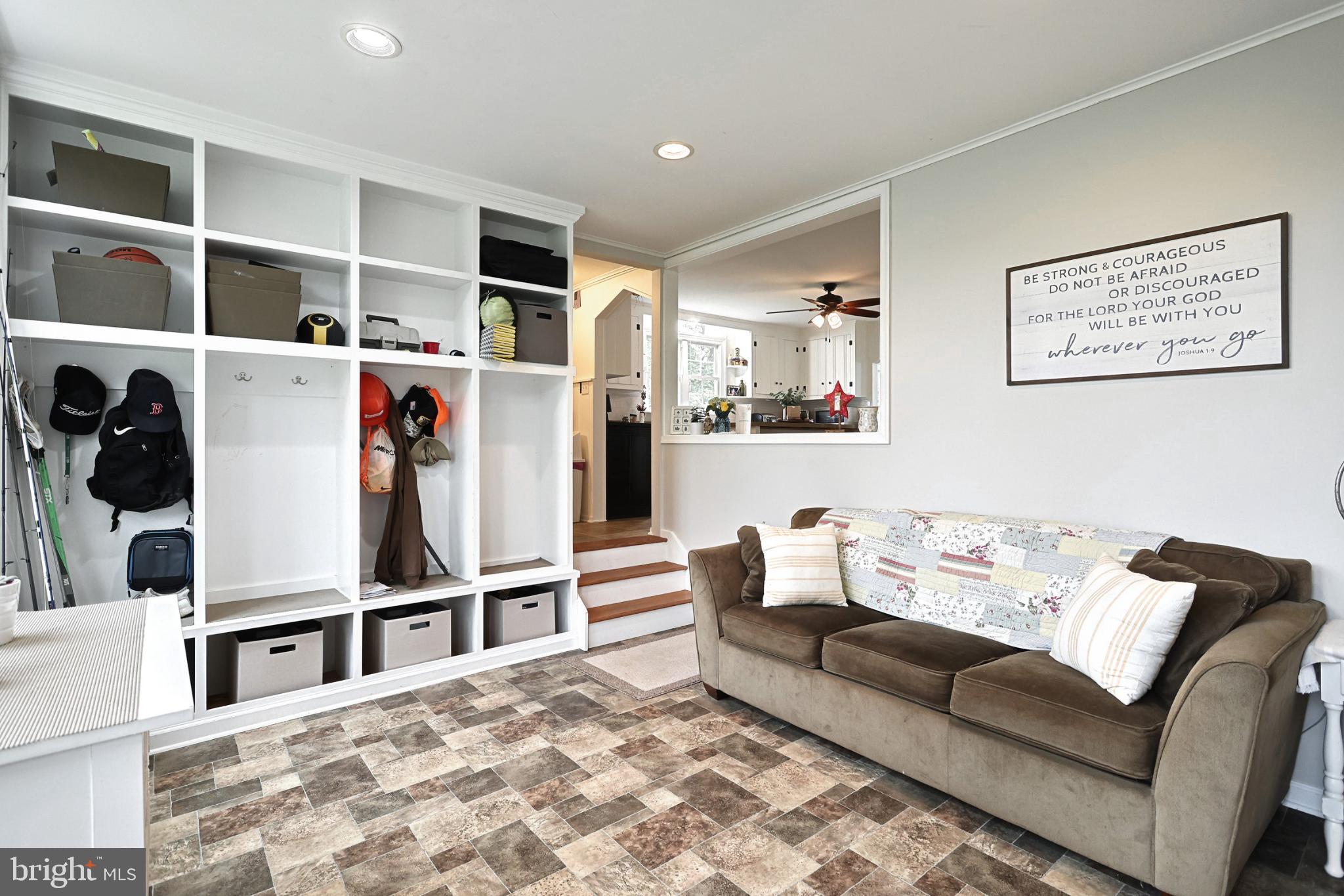 6927 York Road Abbottstown, PA 17301 - Photo 26 of 41 a living room with furniture cabinets and kitchen view