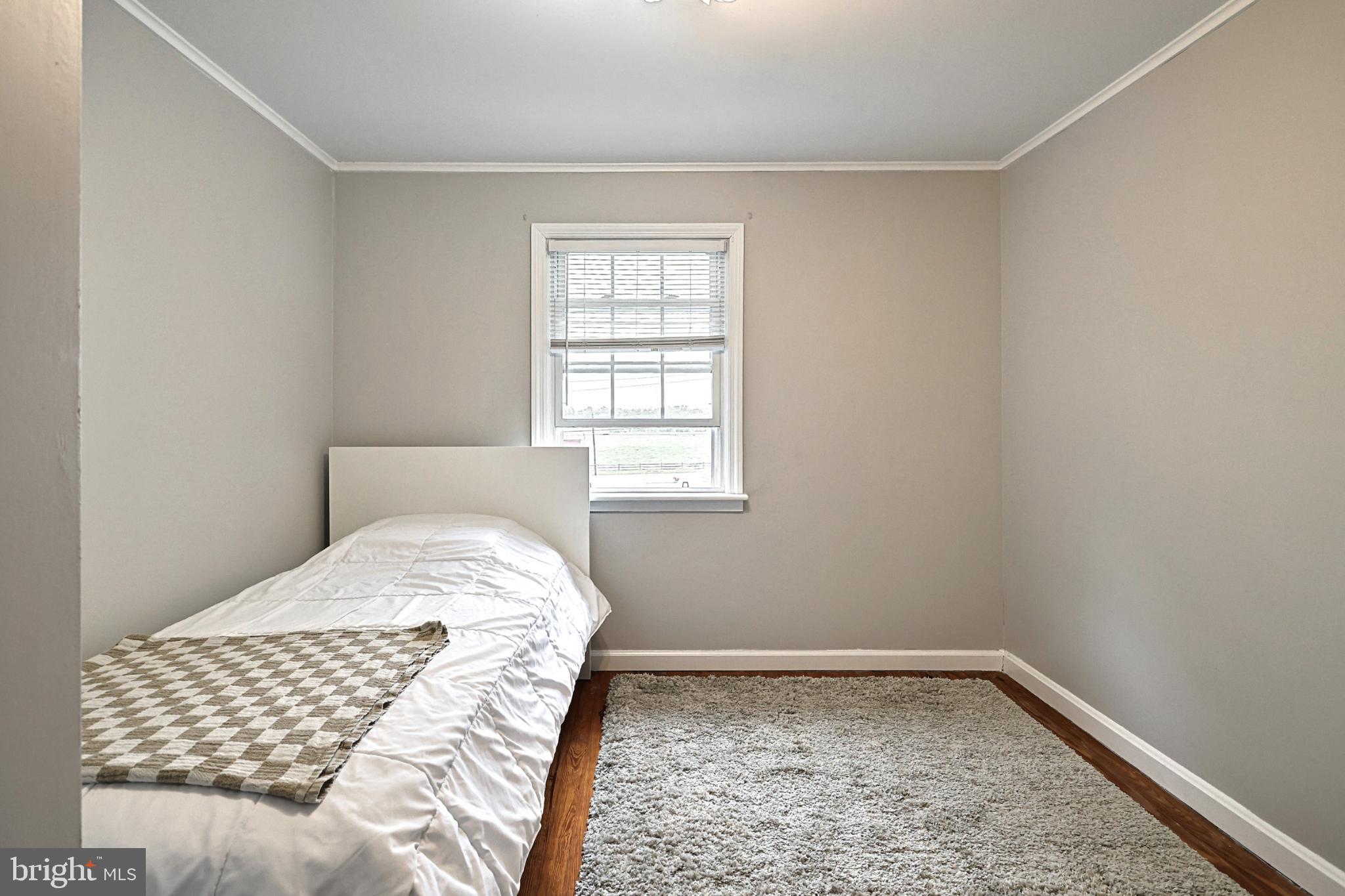 6927 York Road Abbottstown, PA 17301 - Photo 31 of 41 a bedroom with a bed and a window