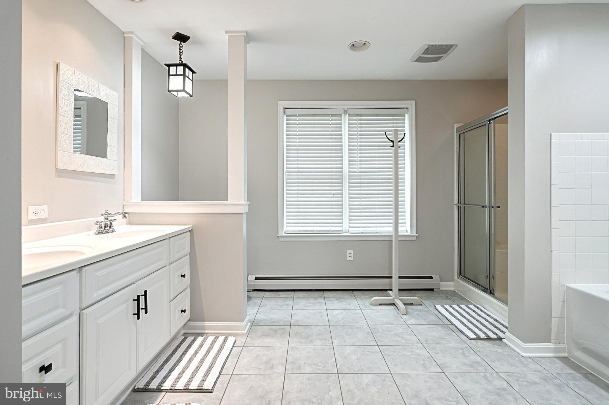 6927 York Road Abbottstown, PA 17301 - Photo 36 of 41 a bathroom with a sink toilet and shower