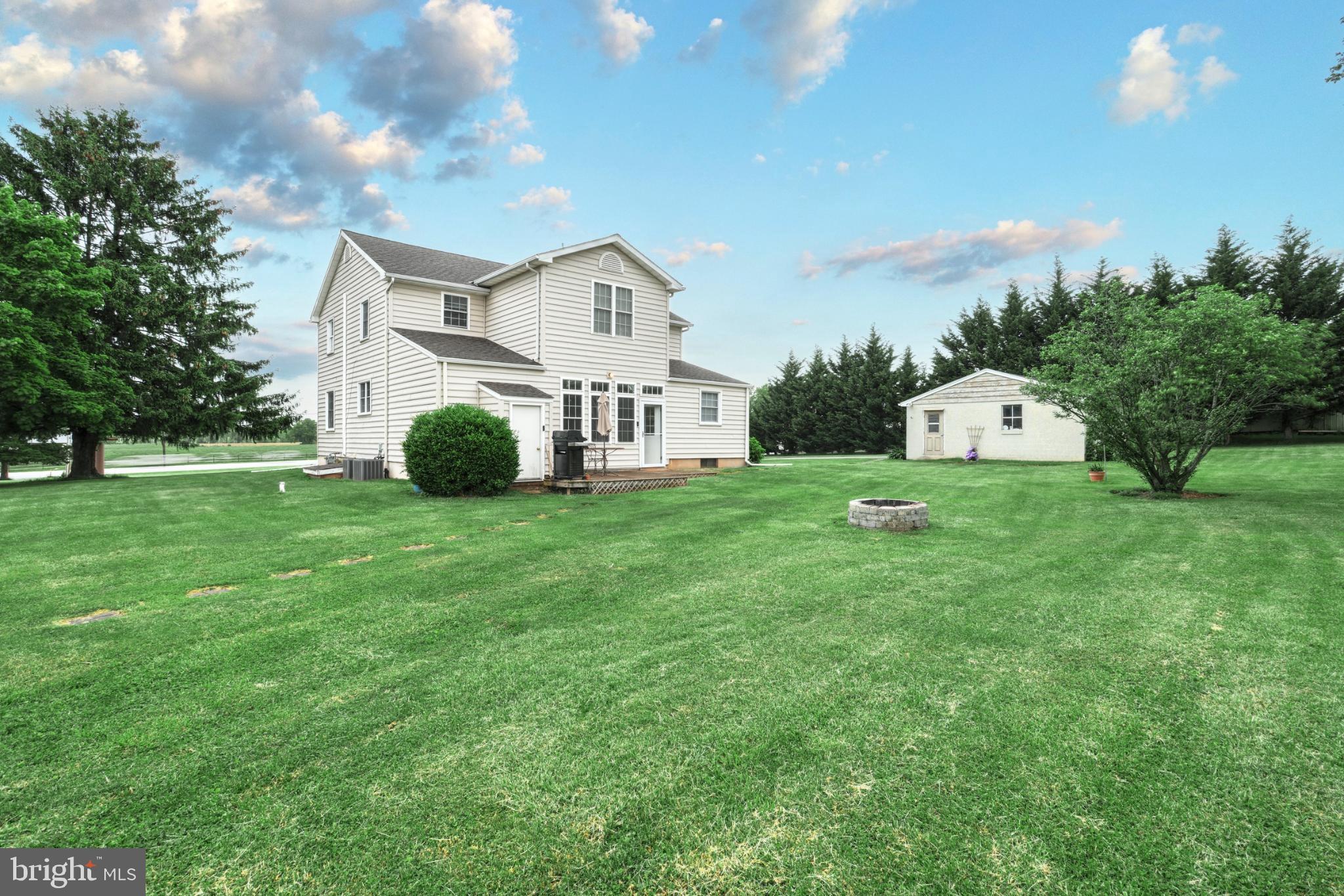 6927 York Road Abbottstown, PA 17301 - Photo 8 of 41 a front view of a house with garden