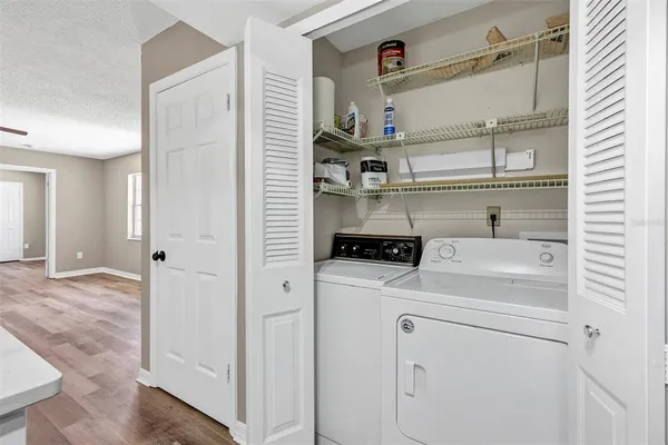 a view of storage and utility room with washer and dryer
