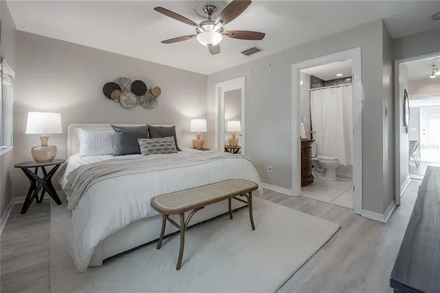 a bedroom with a bed and a walk in closet