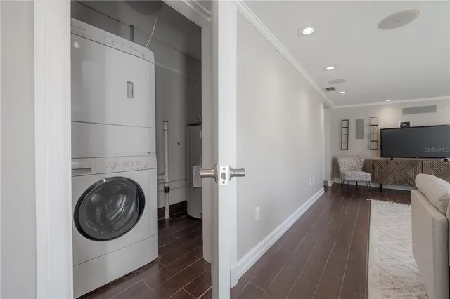 a view of a hallway with washer and dryer