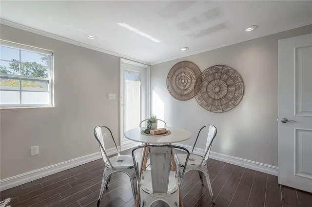a dining room with furniture and window