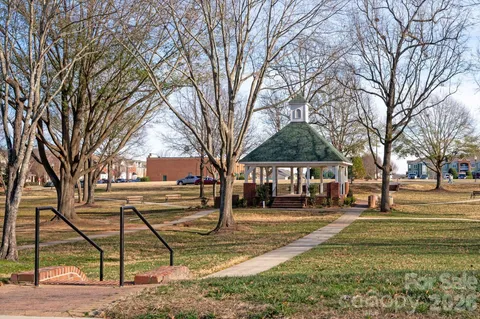 a front view of a residential apartment building with a yard
