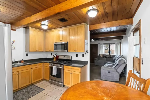 a kitchen with a sink cabinets and window