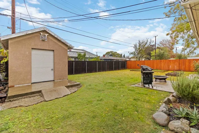 a swimming pool with outdoor seating and yard