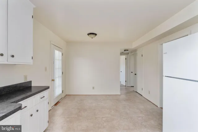 a view of cabinets and window