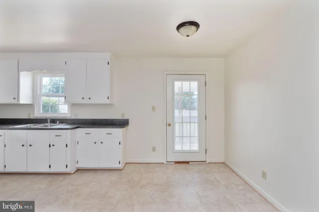 a view of storage and utility room with a window