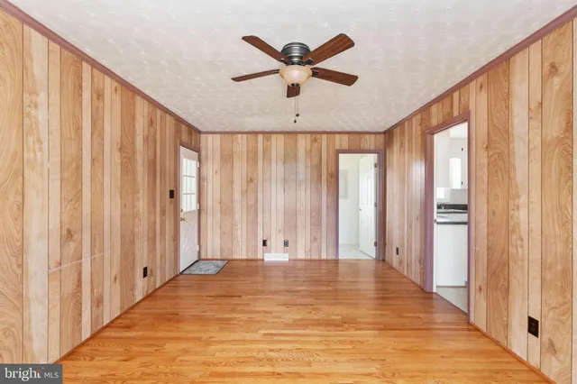 a bathroom with a sink mirror and a toilet