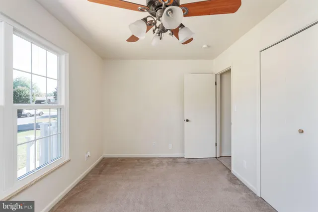 a view of a hallway with closet