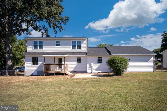 a view of balcony with wooden floor and outdoor seating