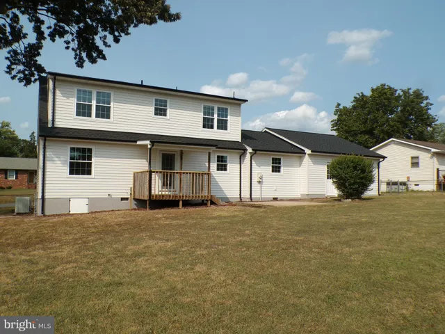 a house with trees in the background