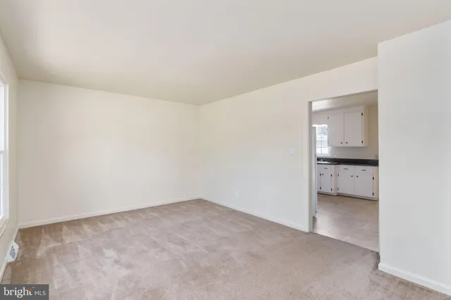 a view of an empty room and window