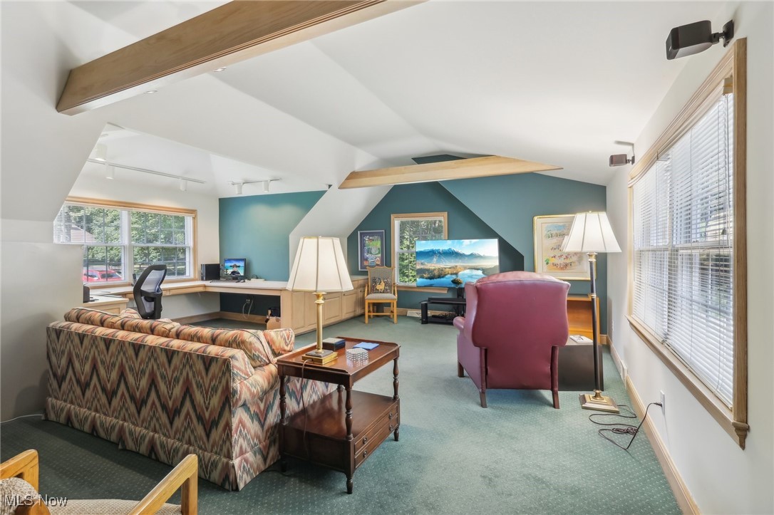 2060 Stockbridge Road Akron, OH 44313 - Photo 31 of 41 Carpeted living room featuring vaulted ceiling with beams and track lighting