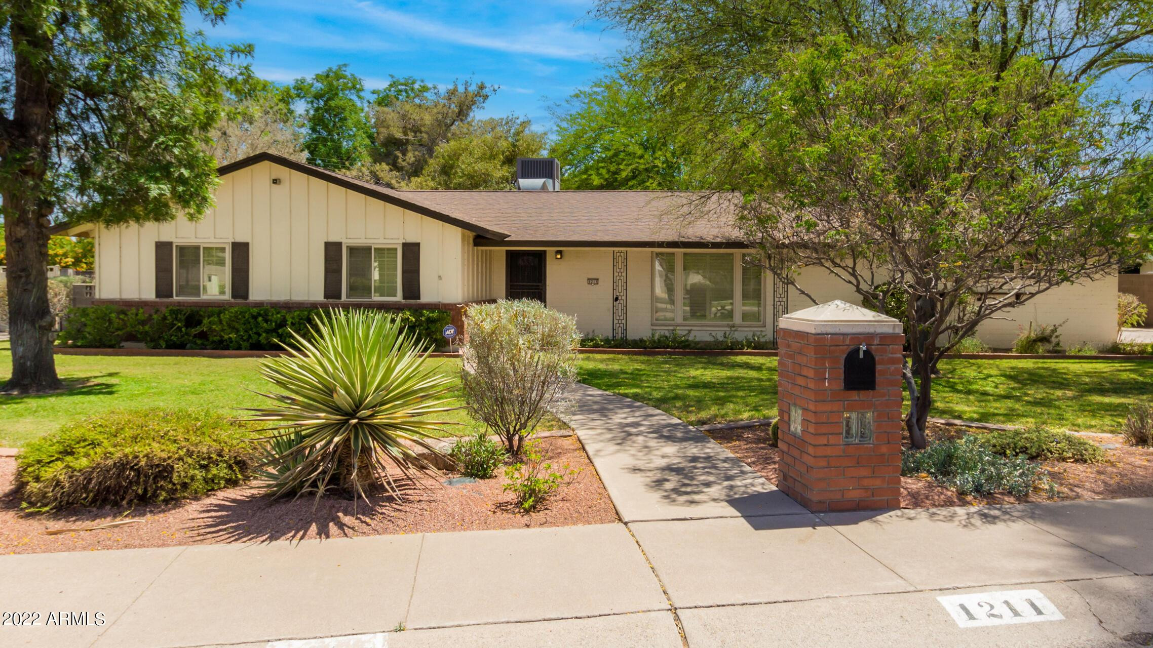 1211 West Hayward Avenue Phoenix, AZ 85021 - Photo 2 of 26 a view of a house with a yard and potted plants