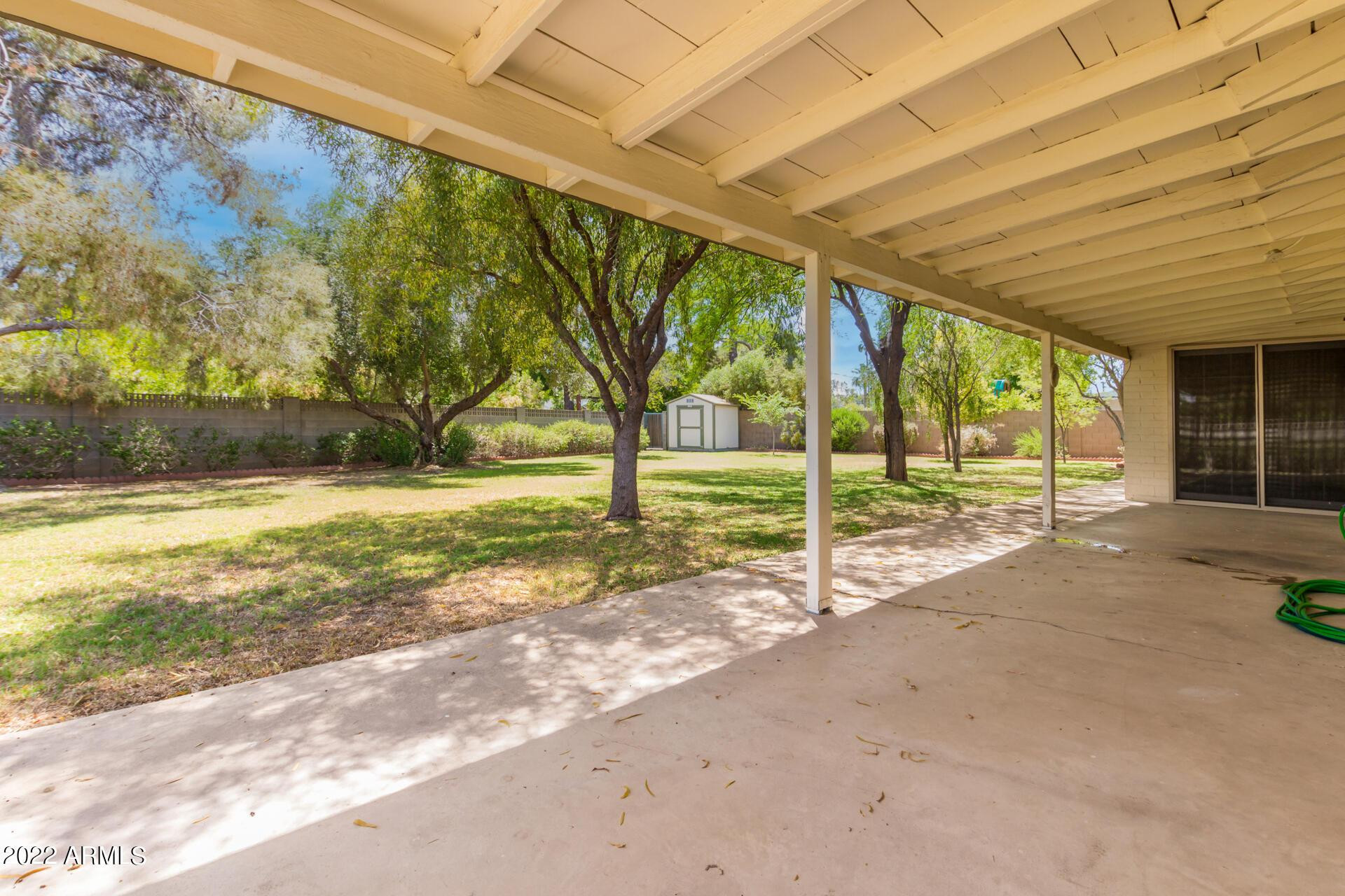 1211 West Hayward Avenue Phoenix, AZ 85021 - Photo 24 of 26 a view of a house with backyard and a trees