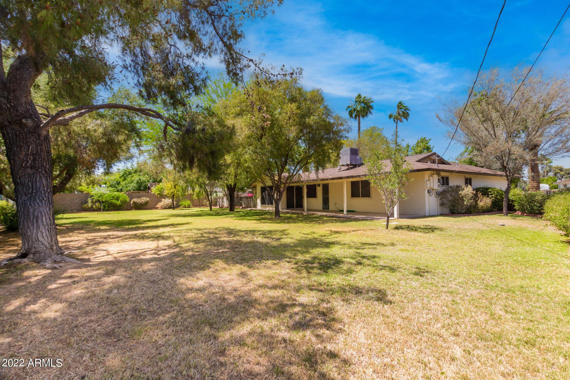 1211 West Hayward Avenue Phoenix, AZ 85021 - Photo 25 of 26 a front view of a house with a yard