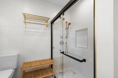 a bathroom with a bathtub and shower