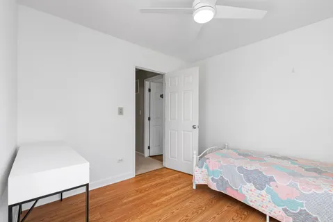 a bedroom with a bed and a table in it