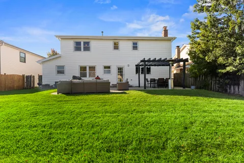 a view of a patio with couches and potted plants