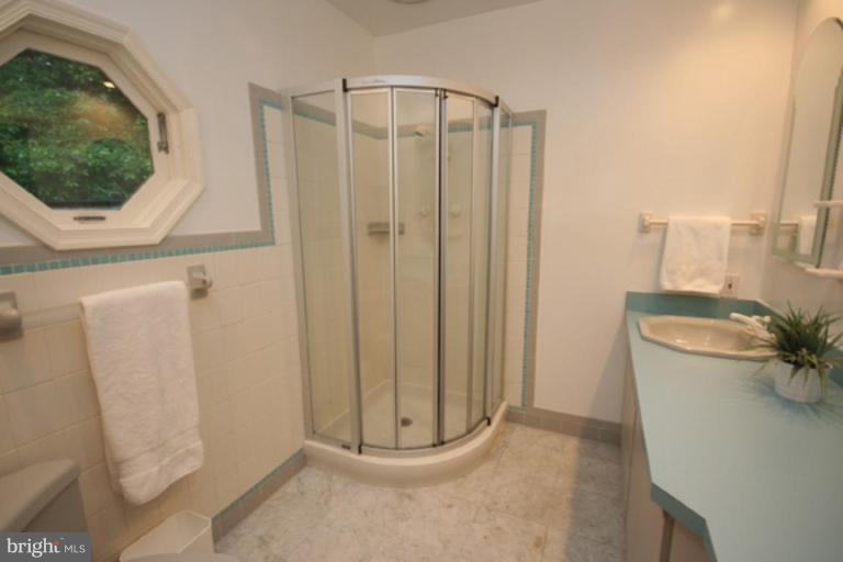 9220 Whitney Street Silver Spring, MD 20901 - Photo 16 of 30 a bathroom with a shower and a sink