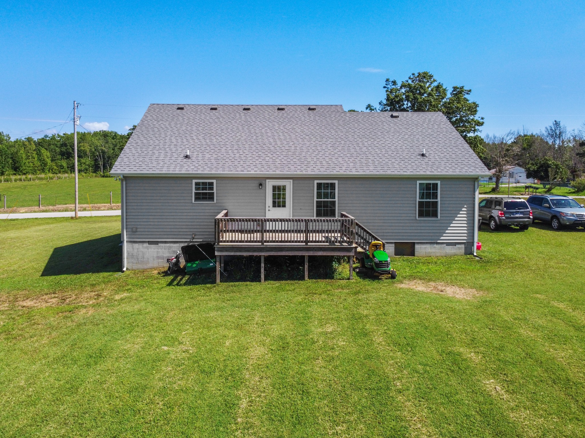 3874 Asbury Road Manchester, TN 37355 - Photo 2 of 25 a backyard of a house with table and chairs