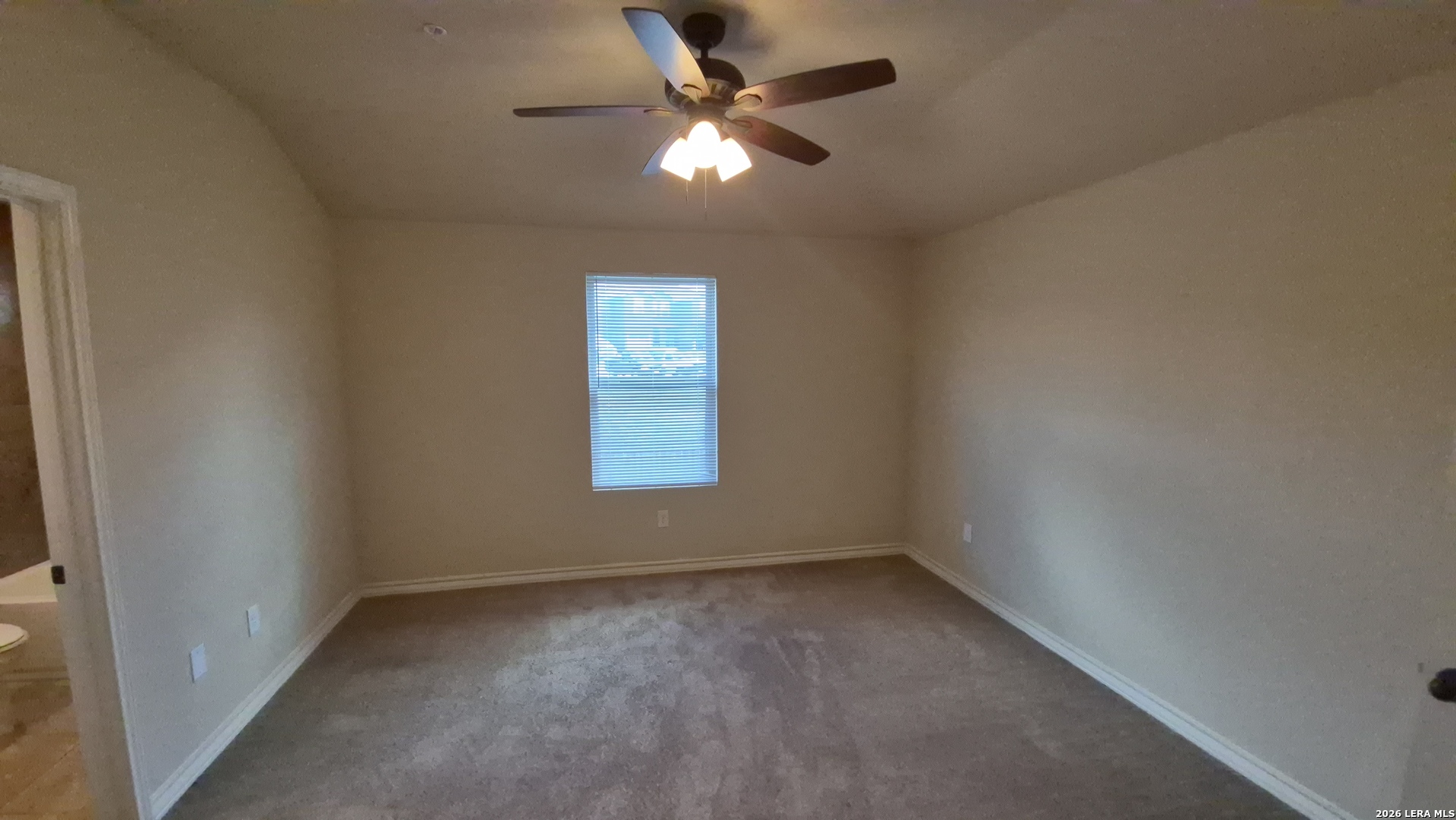 6414 Luglio Lane, Unit 101 San Antonio, TX 78233 - Photo 12 of 23 an empty room with a window and a fan