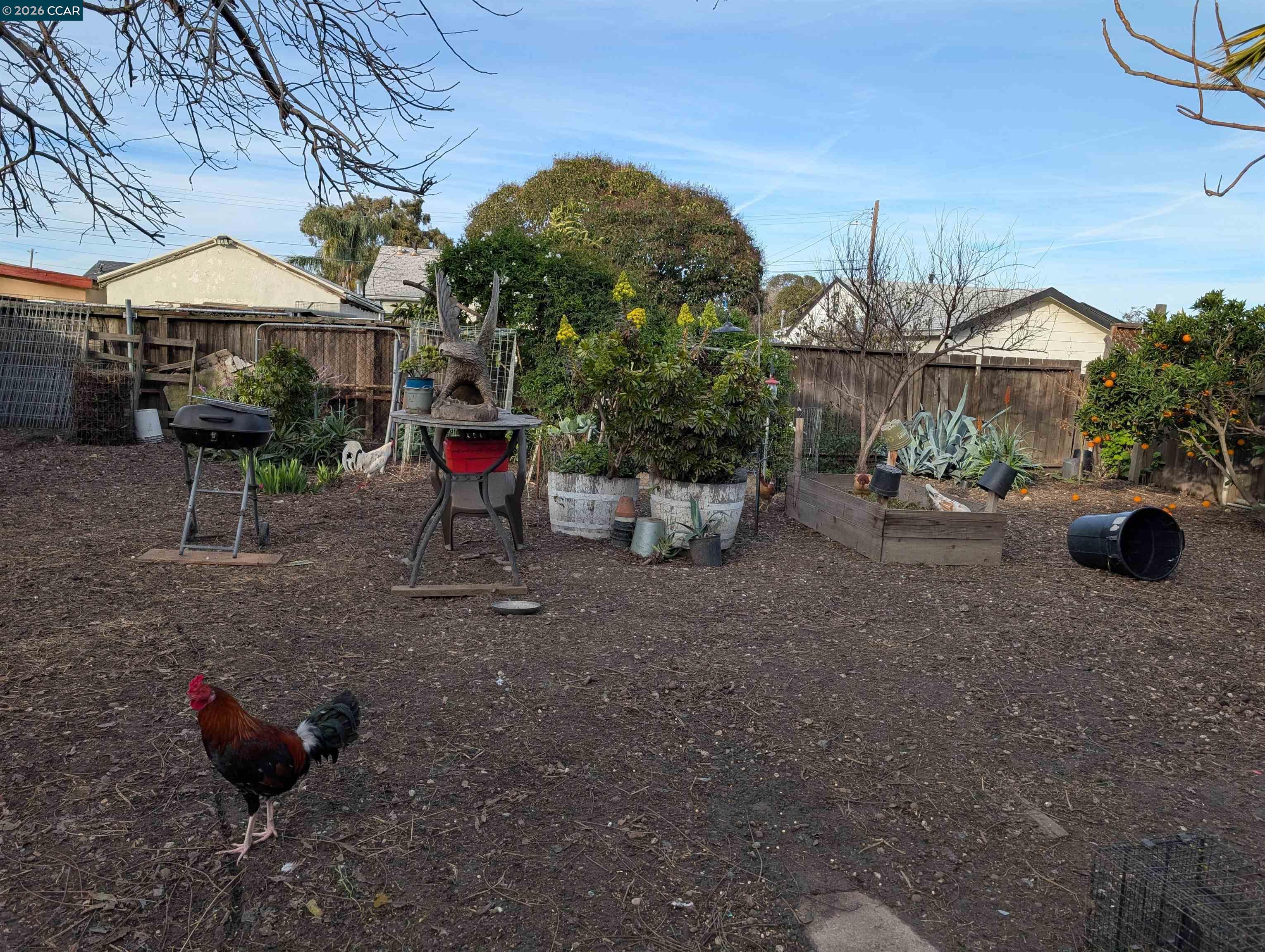 35 Jefferson Street Bay Point, CA 94565 - Photo 12 of 13 a backyard of a house with barbeque oven table and chairs