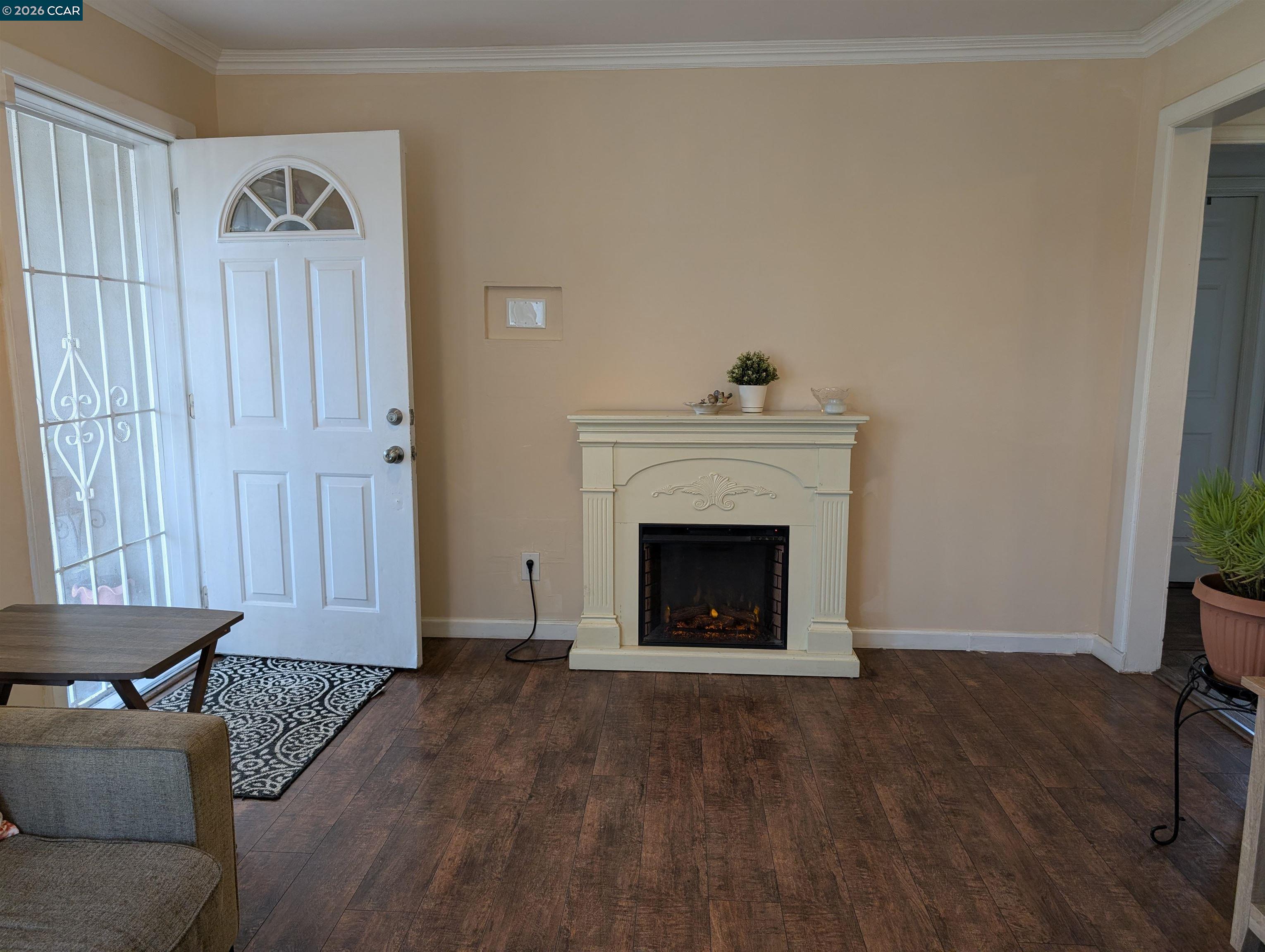 35 Jefferson Street Bay Point, CA 94565 - Photo 2 of 13 a living room with furniture and a fireplace