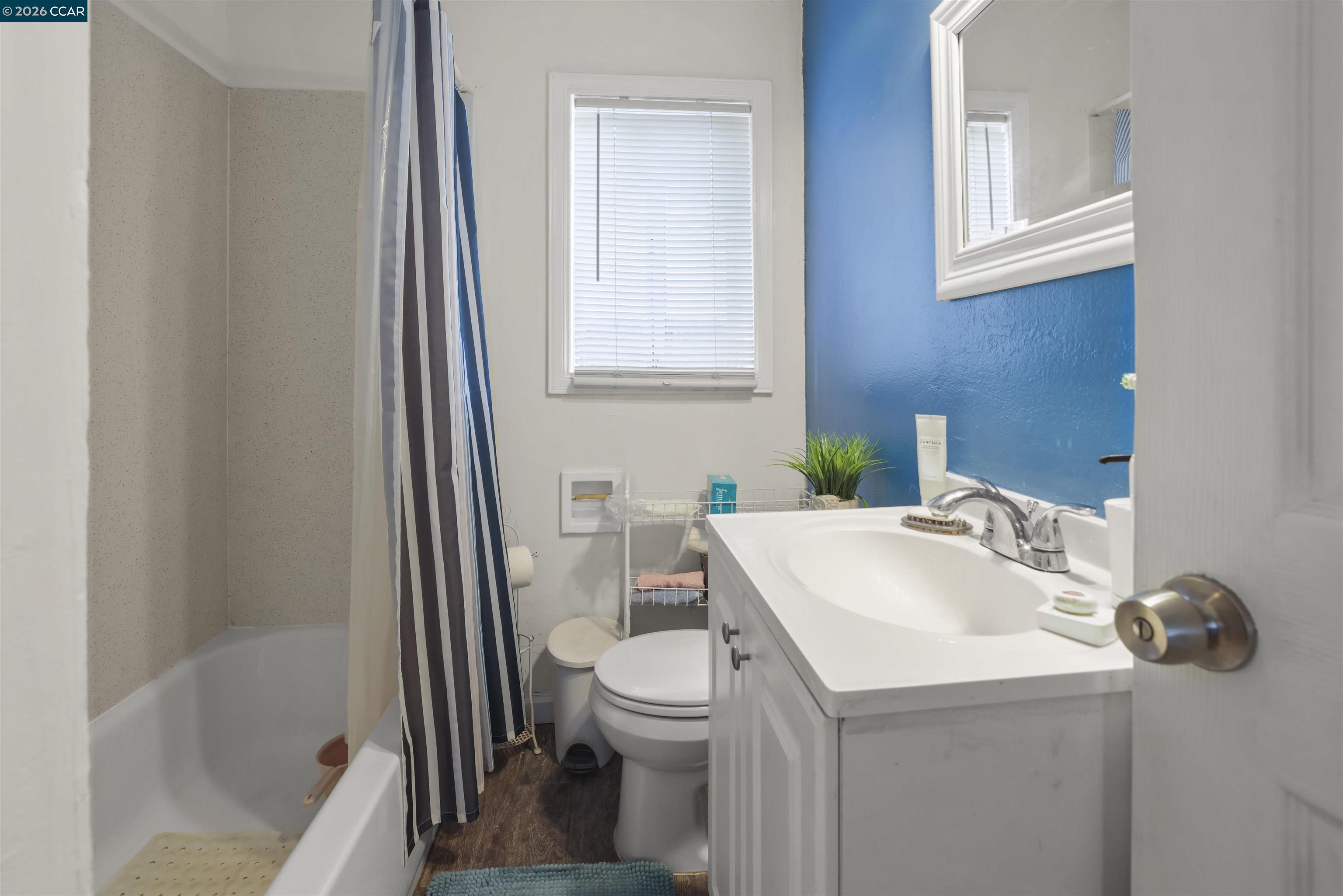 35 Jefferson Street Bay Point, CA 94565 - Photo 8 of 13 a bathroom with a sink a toilet and shower