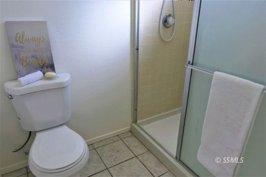 337 Larkspur Street Ridgecrest, CA 93555 - Photo 24 of 38 a bathroom with a toilet and a shower