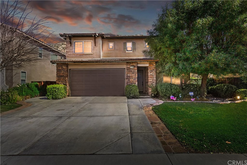 17294 Riva Ridge Drive Moreno Valley, CA 92555 - Photo 1 of 1 a front view of a house with garden