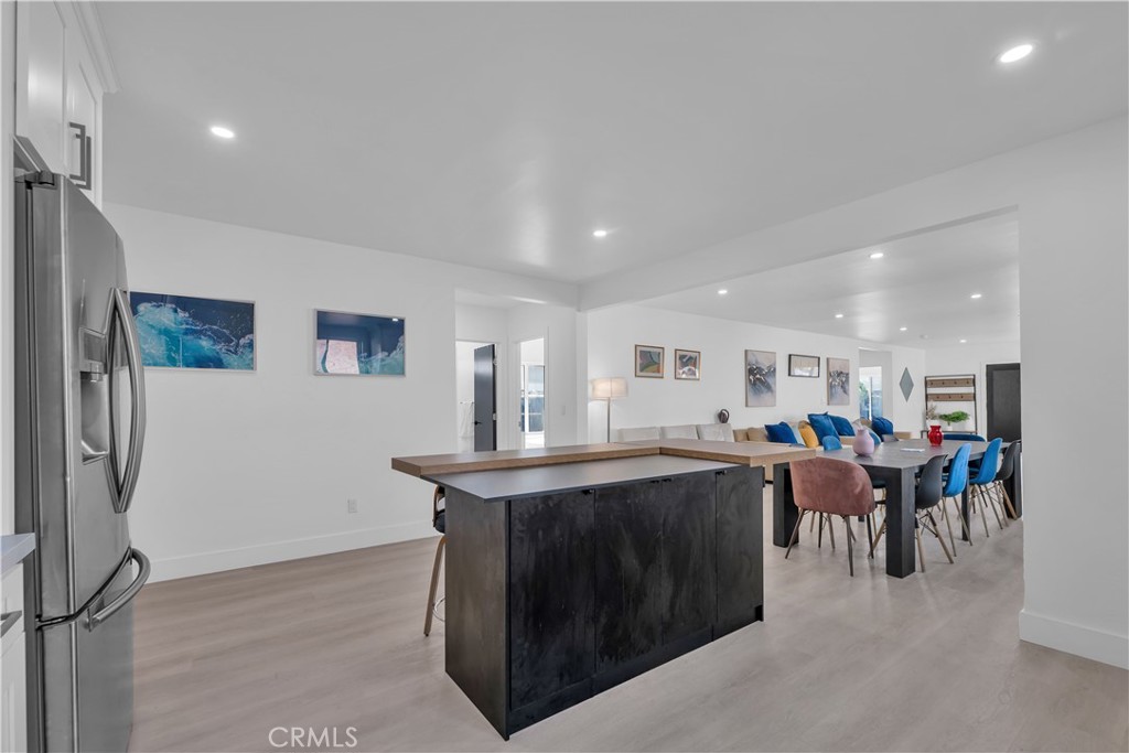 3115 Arvia Street, Unit 1A Los Angeles, CA 90065 - Photo 22 of 45 a view of a kitchen with kitchen island a sink a stove and a refrigerator