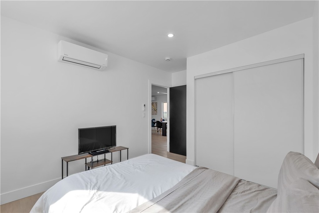 3115 Arvia Street, Unit 1A Los Angeles, CA 90065 - Photo 32 of 45 a bedroom with a bed and a flat screen tv