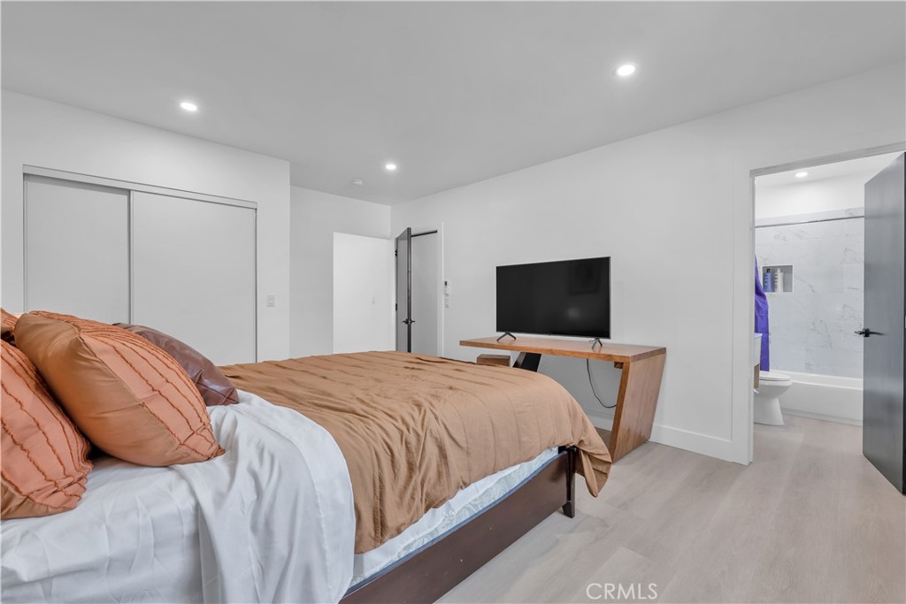 3115 Arvia Street, Unit 1A Los Angeles, CA 90065 - Photo 36 of 45 a bedroom with a bed and a flat screen tv