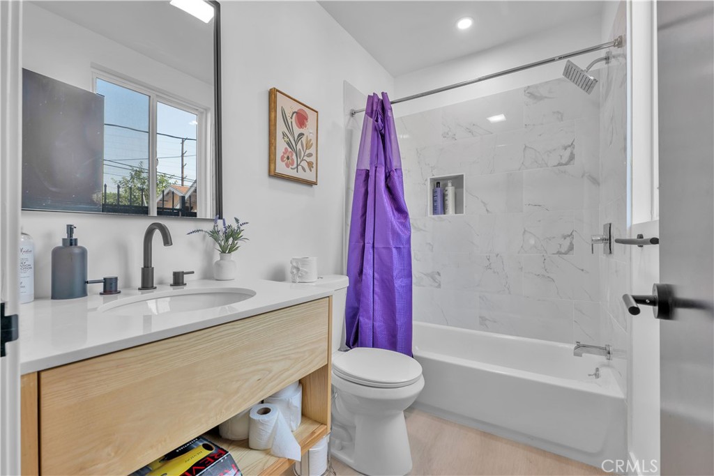 3115 Arvia Street, Unit 1A Los Angeles, CA 90065 - Photo 37 of 45 a bathroom with a sink vanity mirror and toilet
