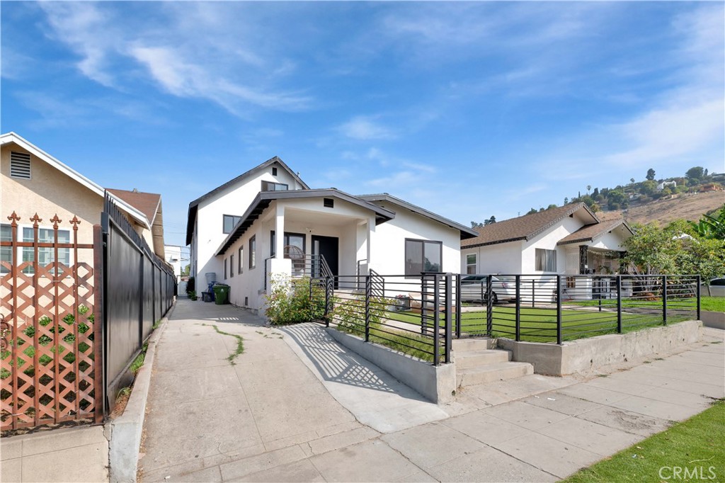 3115 Arvia Street, Unit 1A Los Angeles, CA 90065 - Photo 42 of 45 a view of a building with a yard