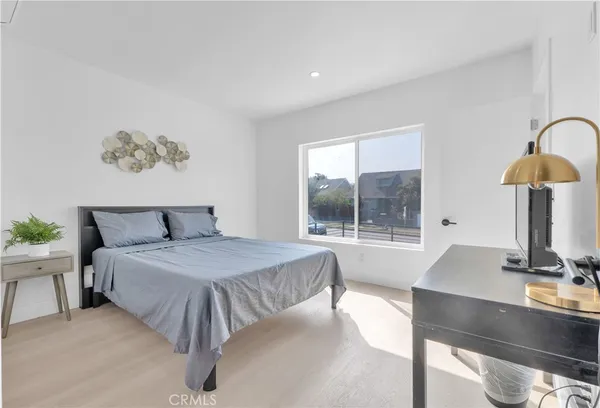 a bedroom with a bed and a table