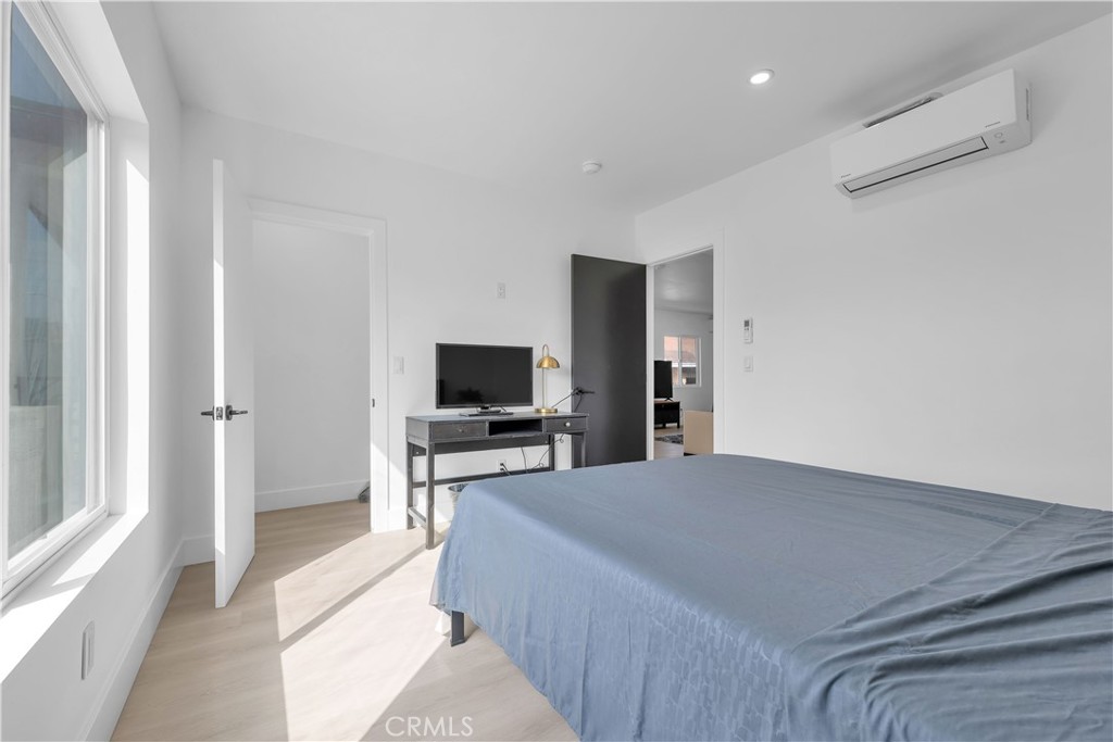 3115 Arvia Street, Unit 1A Los Angeles, CA 90065 - Photo 7 of 45 a bedroom with a bed and a television in it