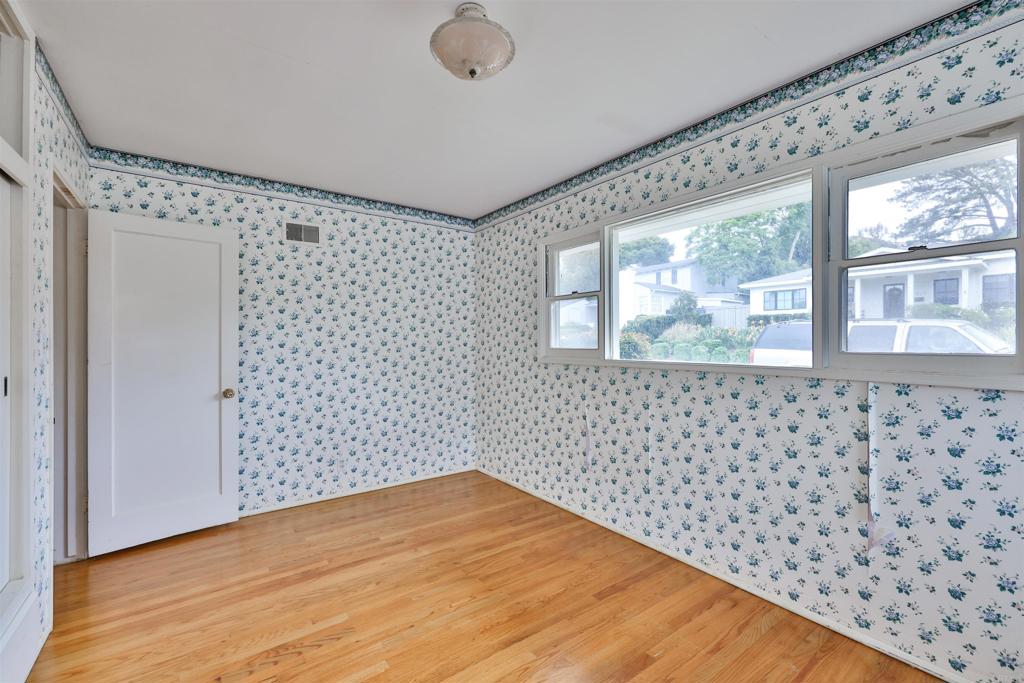 5930 Waverly Avenue La Jolla, CA 92037 - Photo 12 of 61 a view of a black door and wooden floor