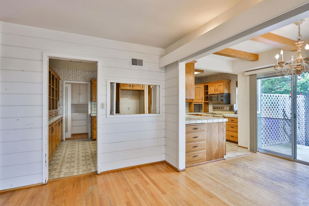 5930 Waverly Avenue La Jolla, CA 92037 - Photo 21 of 61 a view of open kitchen with granite countertop cabinets and wooden floor