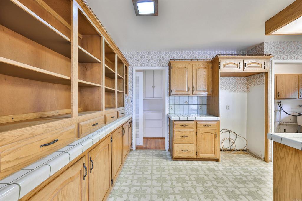 5930 Waverly Avenue La Jolla, CA 92037 - Photo 25 of 61 a view of kitchen with stainless steel appliances granite countertop cabinets and window