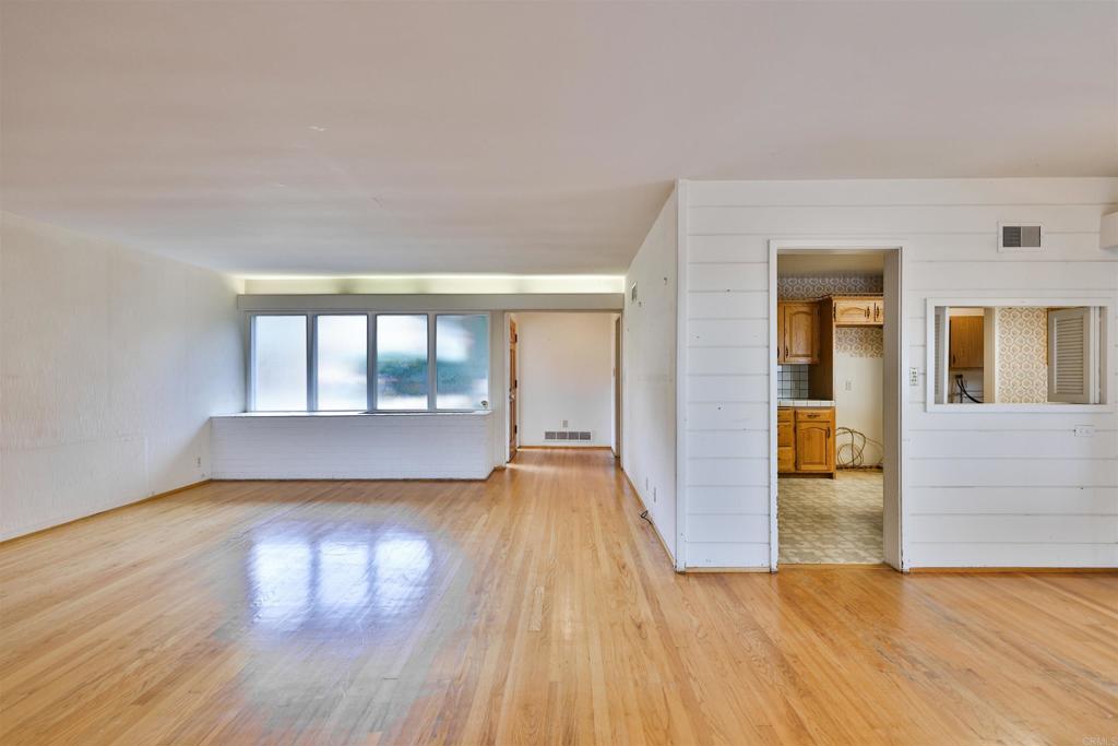 5930 Waverly Avenue La Jolla, CA 92037 - Photo 29 of 61 wooden floor in an empty room with a window