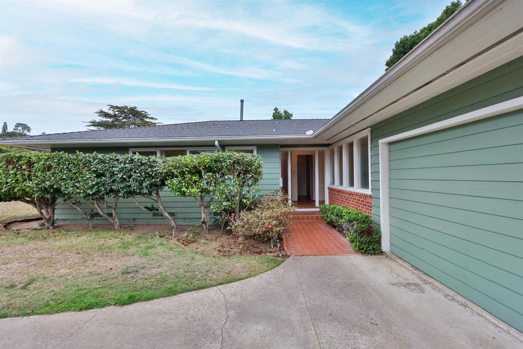 5930 Waverly Avenue La Jolla, CA 92037 - Photo 3 of 61 a front view of a house with a yard and potted plants