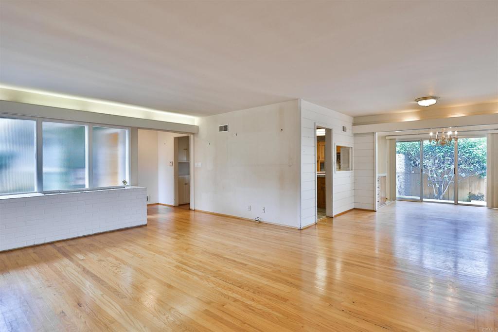 5930 Waverly Avenue La Jolla, CA 92037 - Photo 33 of 61 a view of an empty room with wooden floor and a window