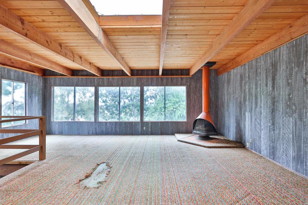 5930 Waverly Avenue La Jolla, CA 92037 - Photo 37 of 61 a view of a room with wooden floor and iron stairs