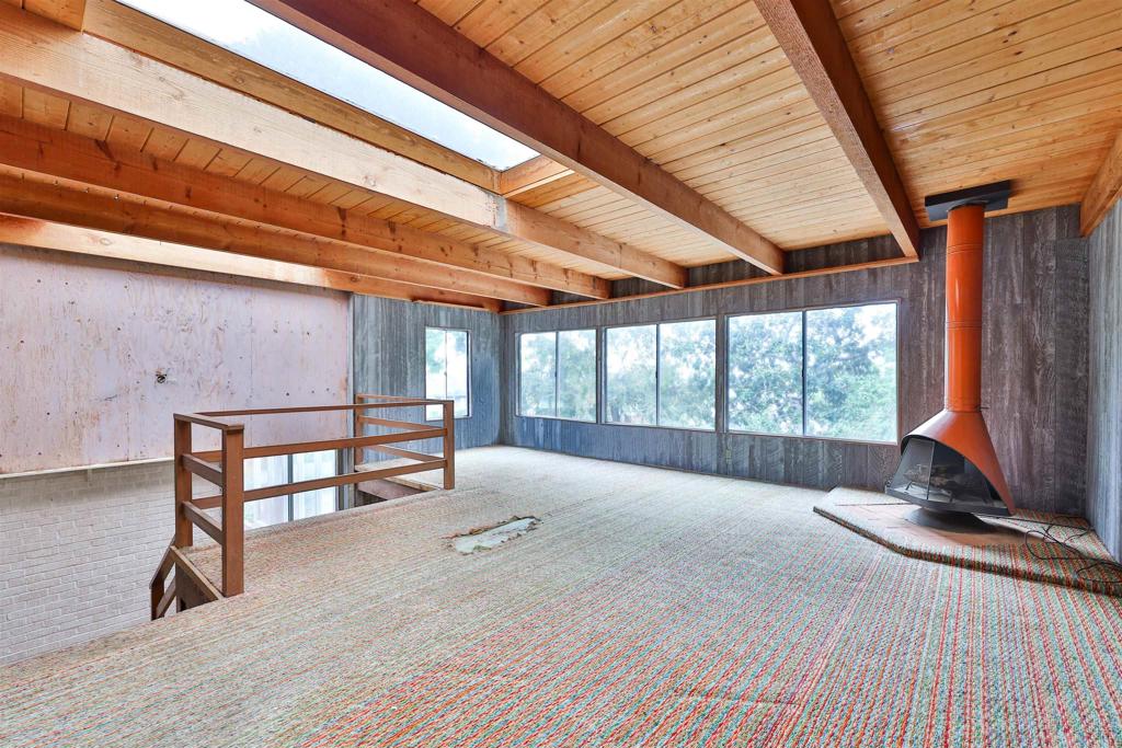 5930 Waverly Avenue La Jolla, CA 92037 - Photo 38 of 61 a view of an empty room with wooden floor and a window