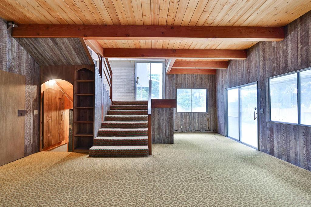 5930 Waverly Avenue La Jolla, CA 92037 - Photo 42 of 61 a view of a room that has a bed and wooden floor