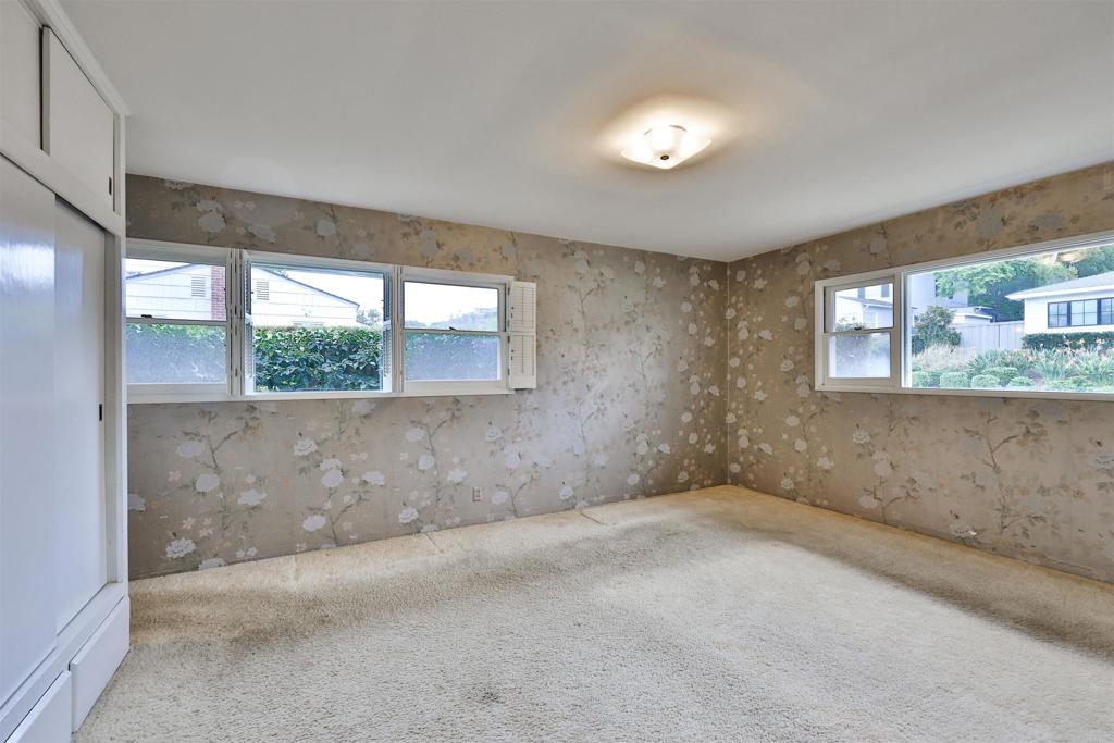 5930 Waverly Avenue La Jolla, CA 92037 - Photo 5 of 61 an empty room with a empty space and windows